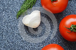 Tomatoes on grey background