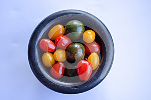 Tomatoes in group on white background