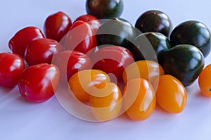 Tomatoes in group on white background