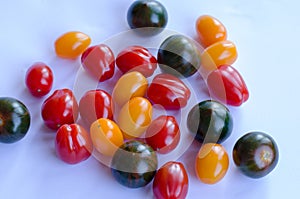 Tomatoes in group on white background