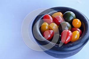 Tomatoes in group on white background