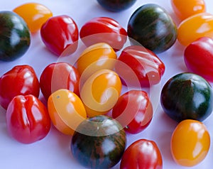 Tomatoes in group on white background