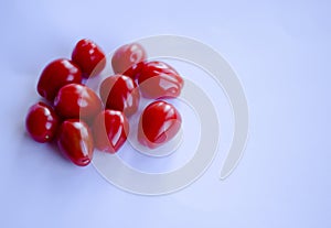 Tomatoes in group on white background