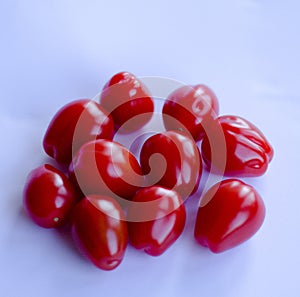 Tomatoes in group on white background