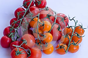 Tomatoes in group on white background