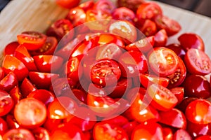 Tomatoes macro, red healthy vegetable sliced on wooden desk. Macro detail of red fresh tomato from garden.