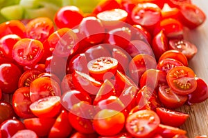 Tomatoes macro, red healthy vegetable sliced on wooden desk. Macro detail of red fresh tomato from garden.