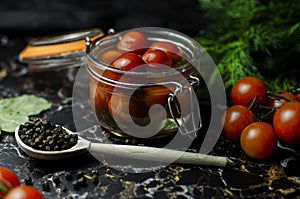 Tomatoes marinated in a glass jar