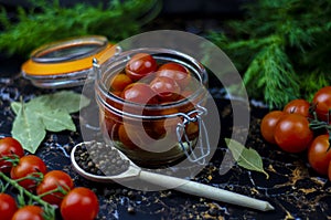 Tomatoes marinated in a glass jar