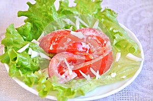 Tomatoes with mayonnaise on lettuce