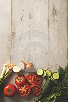 Tomatoes, onions, cucumbers, dill, parcel from top view