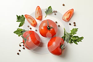 Tomatoes, parsley and pepper on white background