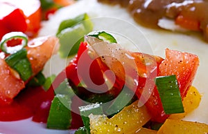 Tomatoes an pepper salad to the dinner