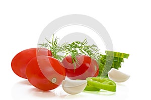 Tomatoes, peppers, garlic, cucumbers on white isolated background
