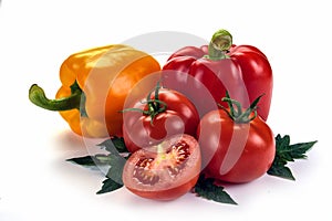 tomatoes and peppers with leaves