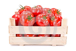 Tomatoes (Solanum lycopersicum) in wooden crate