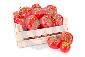 Tomatoes (Solanum lycopersicum) in wooden crate