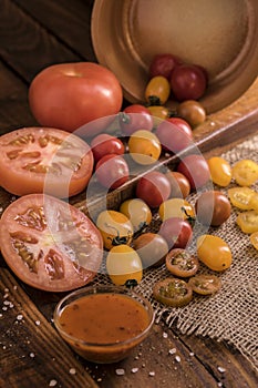 Tomatoes spreading out on a wooden board