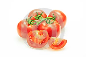 Tomatoes with stem with one cut in pieces