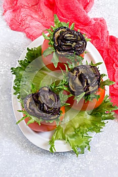 Tomatoes stuffed with cheese with eggplants in form of rose