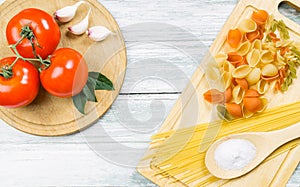 Tomatoes and uncooked assorted pasta