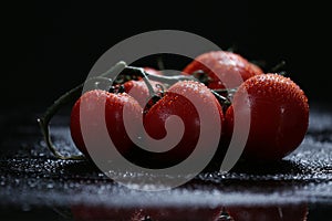 Tomatoes under water drops