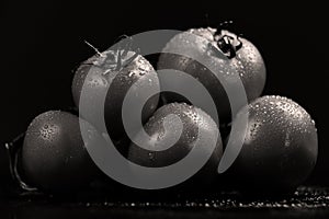 Tomatoes under water drops