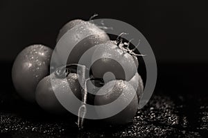 Tomatoes under water drops