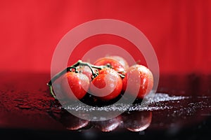 Tomatoes under water drops