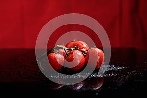 Tomatoes under water drops