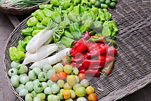 Tomatos, peppers, turnips and other vegetables sold in a Cambodian food street market