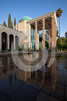 Tomb of Saadi in Shiraz Reflected on Wet Floor on a Sunny Day