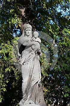 Tomb sculpture of a woman with a child