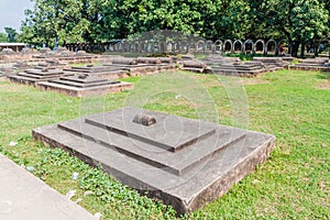 Tombs at the grounds of Choto Shona Mosque Small Golden Mosque in Banglade photo