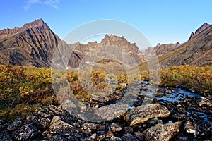 Tombstone Mountain range in Yukon Territory, Canada, showcasing vibrant fall colors