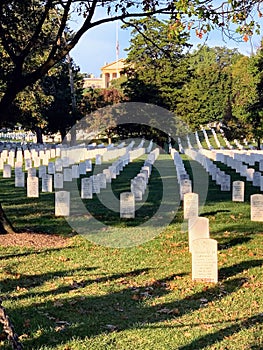 Tombstones at Arlington National Cemetery with Arlington House in the background