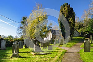 Tombstones in an old cemetery on the church yard in West Sussex, England
