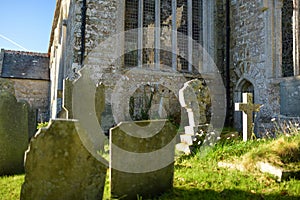 Tombstones in an old cemetery on the church yard in West Sussex, England