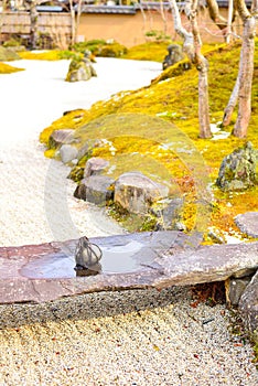 Tome ishi, a path blocking stone, on a small stone bridge