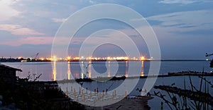 Tomis Harbor lights viewed from Eforie Nord at night photo