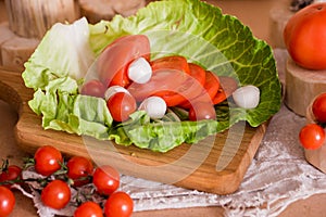 tommaty cherry, fresh greens, lettuce leaf cabbage. The concept of healthy eating. Natural vegetables