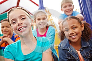 Tomorrows hopes and dreams rest on them. A multi-ethnic group of happy children playing on a jungle gym in a play park.