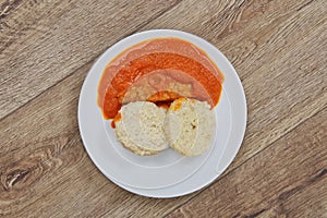 Tomto sauce with dumpling on a table