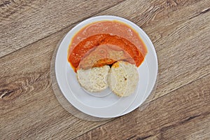 Tomto sauce with dumpling on a table