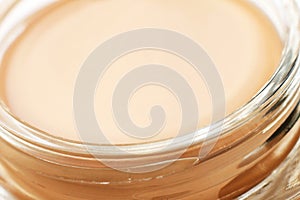 Tonal cream closeup in glass jar