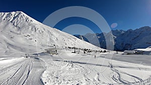 Tonale, Italy. Empty ski slopes due to the closure of ski resorts for the Covid-19 or Coronavirus. Amazing view of the ski slopes