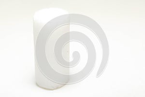 tone-on-tone image, white cylinder on white background. barely visible. abstract.