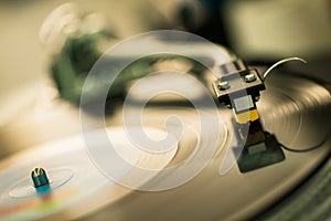 Tonearm on vinyl disc photo