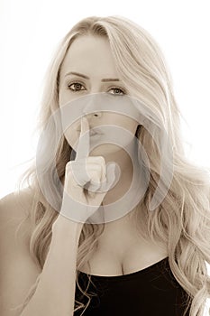 Toned Monochrome Portrait of a Girl Holding Her Finger In Front