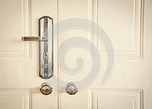 Toned photo metal entrance door with rustic keyed entry door handle at apartment in Hanoi, standard door handle with knob lock